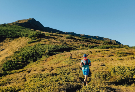 a person hiking up a hill