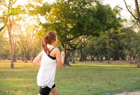 a woman running in a park