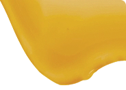 Close-up of a yellow object on a white background