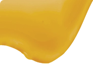 Close-up of a yellow object on a white background